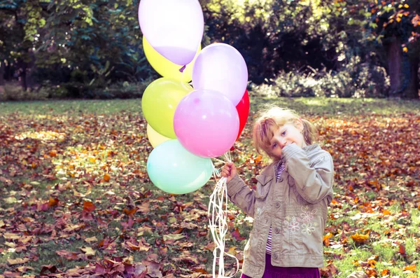 Girl with balloons — Stock Photo, Image