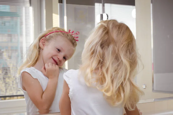 Blond girl in mirror — Stock Photo, Image