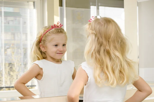 Blond girl in mirror — Stock Photo, Image