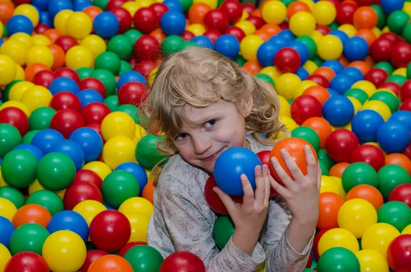 Happy girl playing with balls — Stock Photo, Image