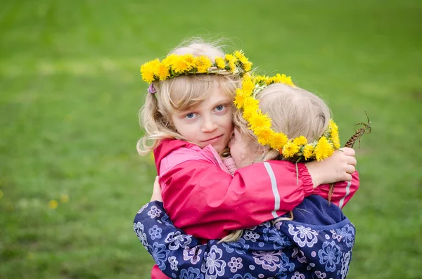 Girls with dandelion chain — Stock Photo, Image