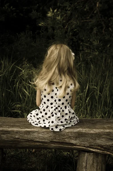 Girl sitting back view — Stock Photo, Image