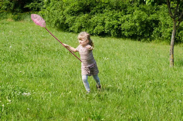 Girl running in meadow — Stock Photo, Image
