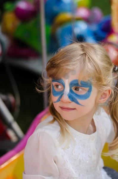 Blond girl with face-painting — Stock Photo, Image