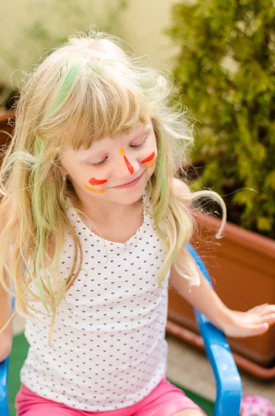 Girl with painted face — Stock Photo, Image