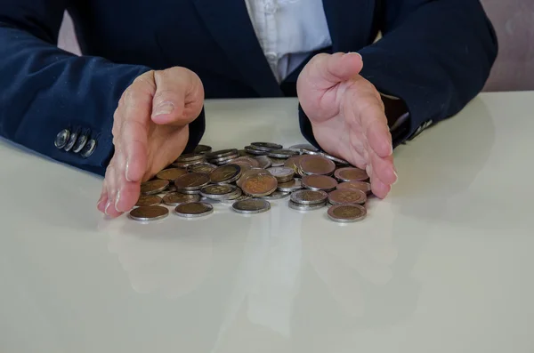 Hand and coins — Stock Photo, Image