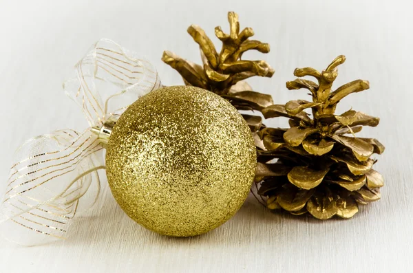 Christmas bauble and pine cones — Stock Photo, Image