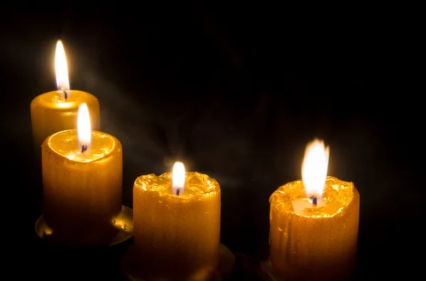 Four candles burning — Stock Photo, Image