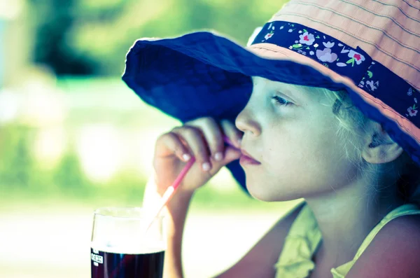 Girl drinking with straw — Stock Photo, Image