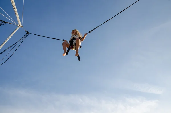 Brave kid jumping high up in skies — Stock Photo, Image