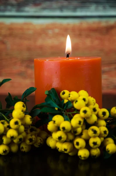 Burning orange candle — Stock Photo, Image