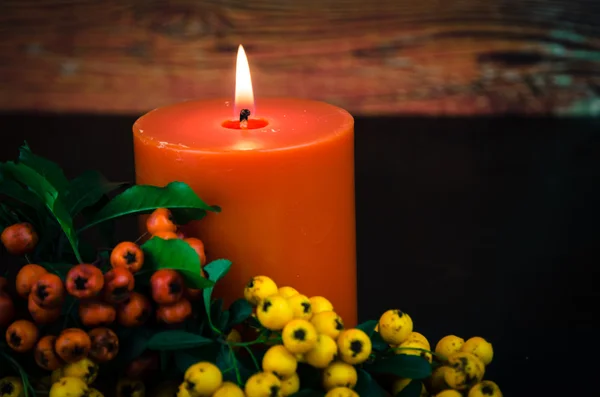 Burning orange candle — Stock Photo, Image