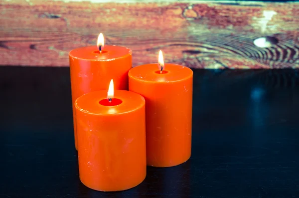 Orange candles burning — Stock Photo, Image