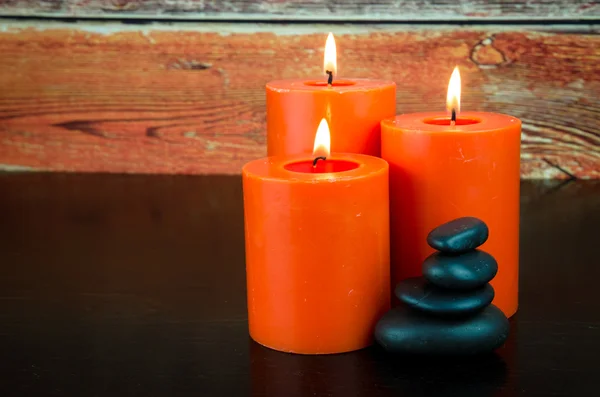 Candles and lava stones — Stock Photo, Image