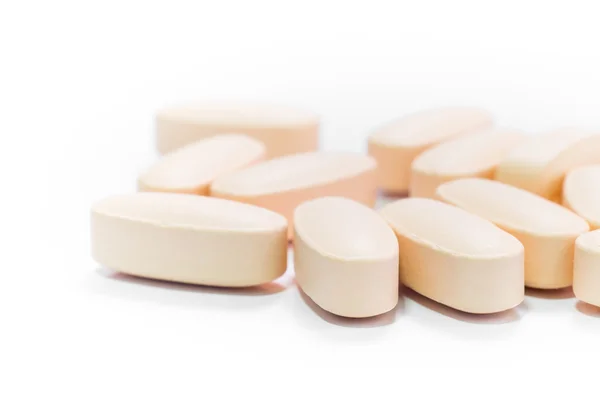 Un mucchio di pillole rotonde arancio medicina compressa — Foto Stock