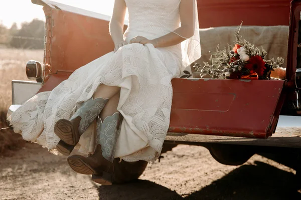 Bride Wedding Dress Sitting Red Truck Truck Cowboy Boots — Stock Photo, Image