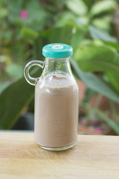 Chocolate milk in glass bottle — Stock Photo, Image