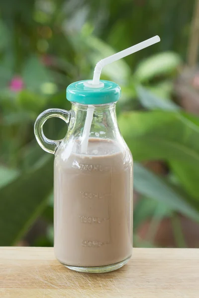 Chocolate milk in glass bottle — Stock Photo, Image