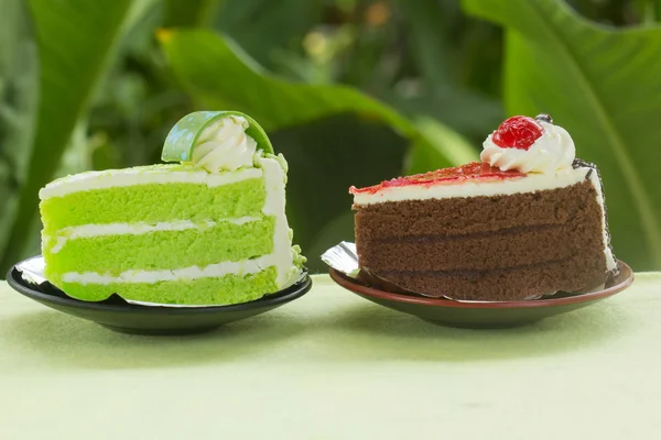 Chocolate cake with strawberry jam and Pandan cake — Stock Photo, Image