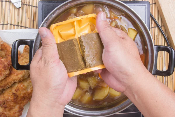 Chef putting Japanese curry pasted for cooking