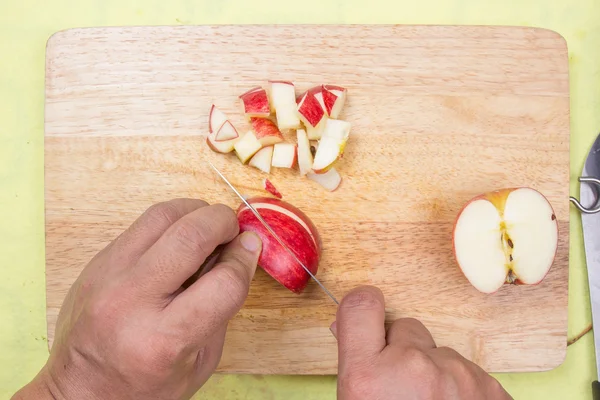 Chef cutting apple — Stock Photo, Image