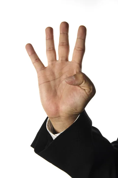 Hand and businessman showing four fingers — Stock Photo, Image