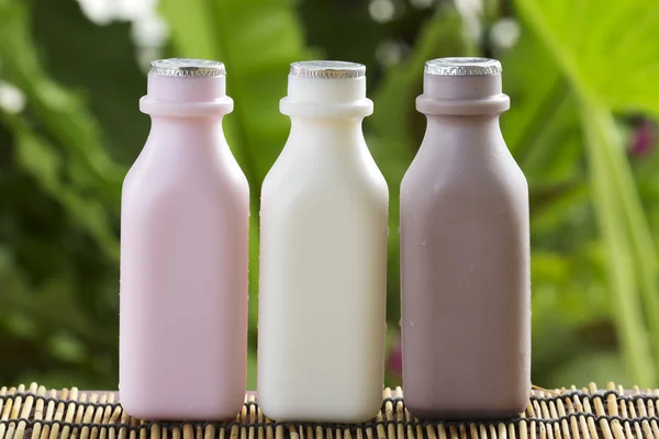 Strawberry, chocolate and fresh milk bottles — Stock Photo, Image