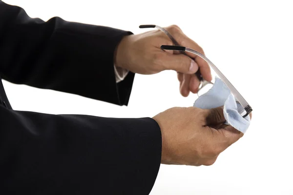 Hands of businessman cleaning glasses — Stock Photo, Image