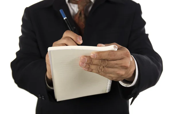Χέρι του επιχειρηματία γράφουν στο σημειωματάριο — Φωτογραφία Αρχείου