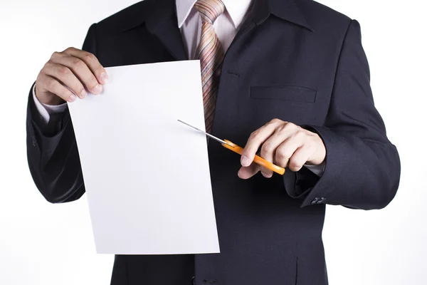 Businessman is cutting a piece of paper — Stock Photo, Image