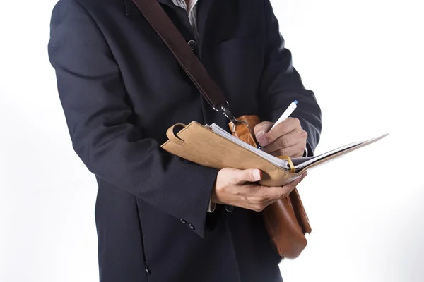 Affärsman med portfölj och skriva boken — Stockfoto