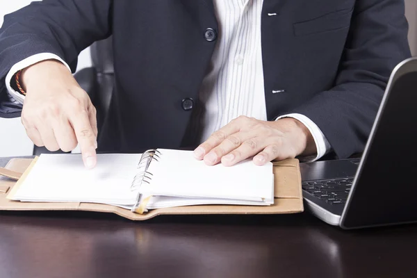 Businessman opening his notebook — Stock Photo, Image