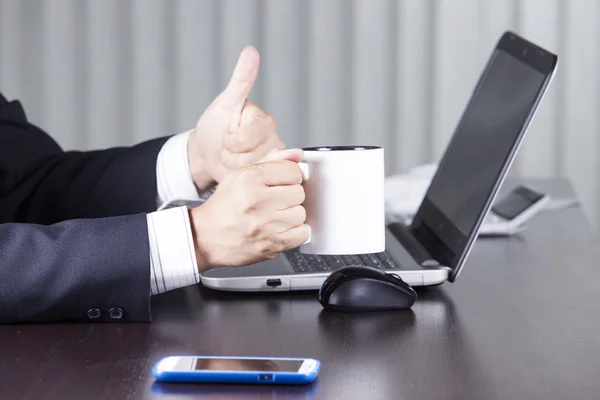 Businessman holding cup of coffee — Stock Photo, Image