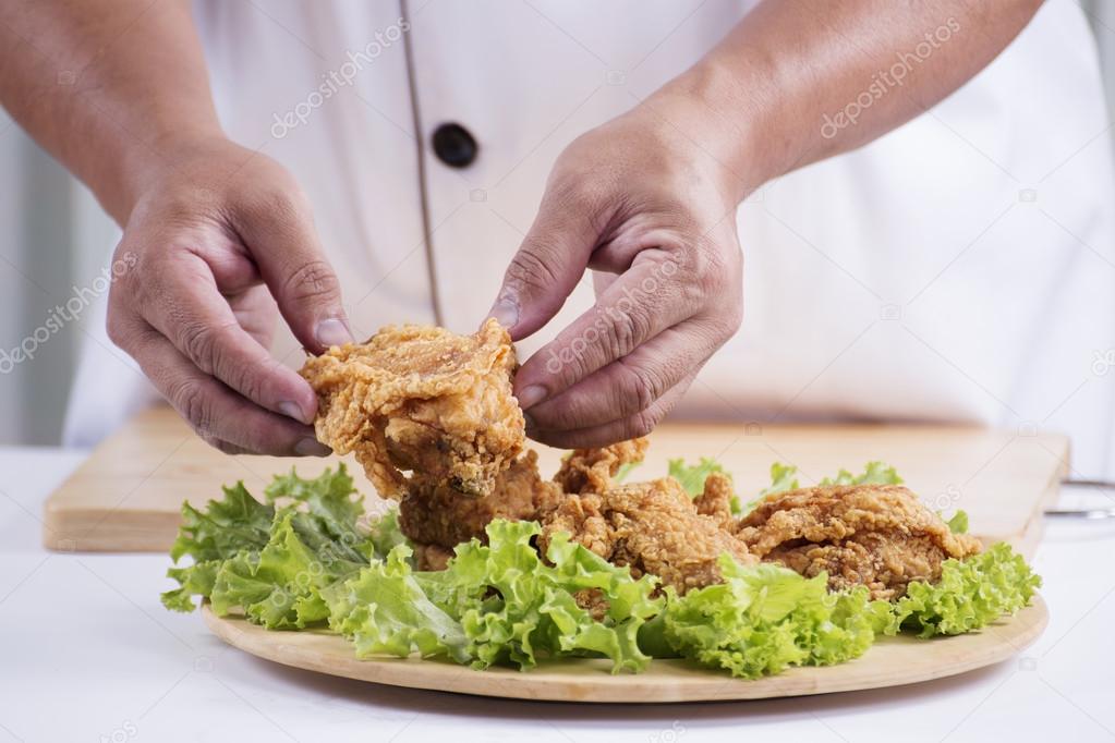 chef cook preparing fried chicken 