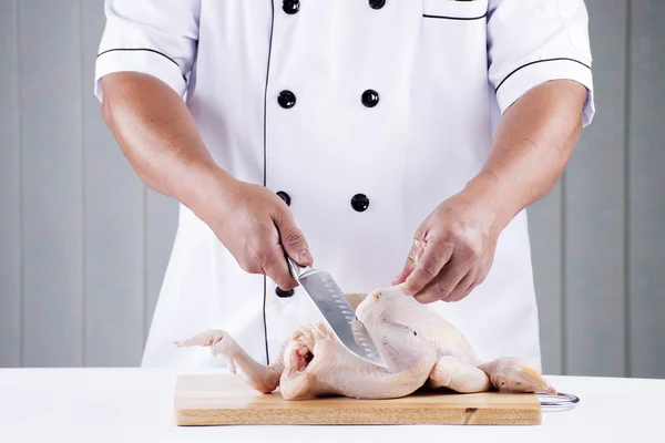 Chef prepared chopping raw chicken — Stock Photo, Image