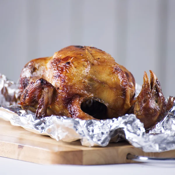 Roast chicken in aluminuim foil — Stock Photo, Image