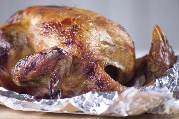 Roast chicken in aluminuim foil — Stock Photo, Image