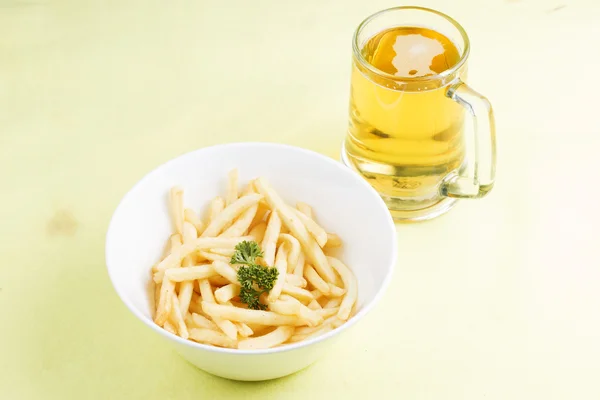 Fresh french fries and beers — Stock Photo, Image