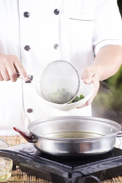 Chef scald vegetable in pot before cooking noodle — Stock Photo, Image