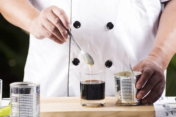 Put condensed milk in to Hot coffee — Stock Photo, Image