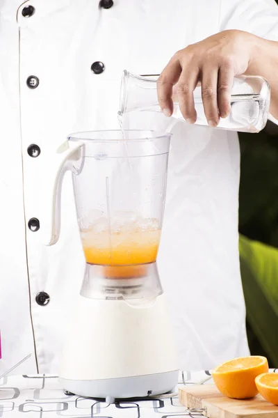 Chef pouring water — Stock Photo, Image