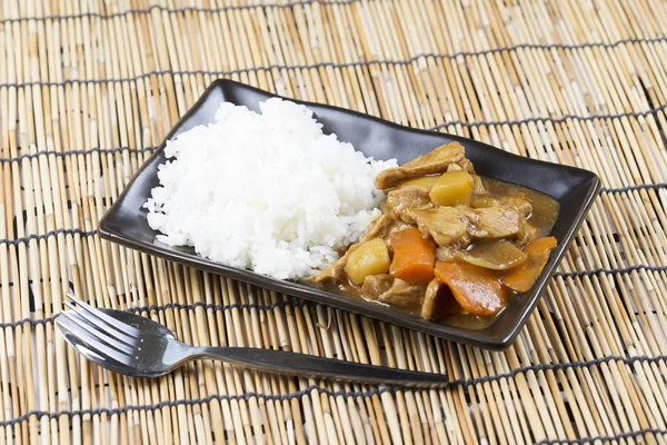 Carne di maiale giapponese con riso, carota, cipolla e patate — Foto Stock