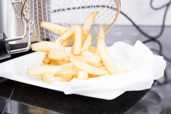 French Fried putting on the Plate — Stock Photo, Image