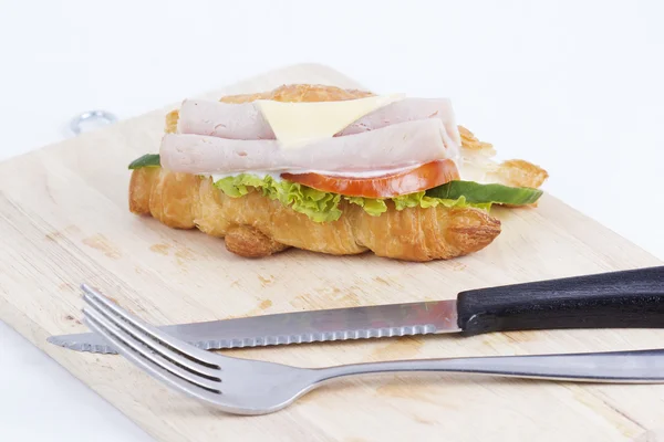 Croissant sandwich with ham cheese — Stock Photo, Image