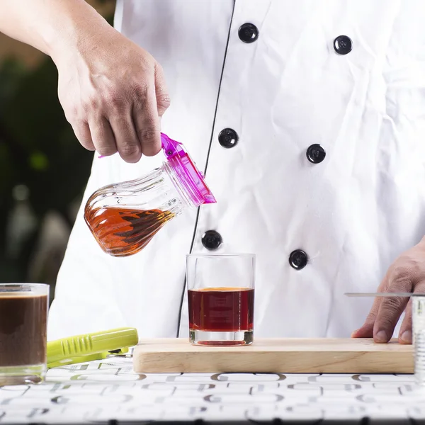 Pouring Syrup to cup of Tea — Stock Photo, Image