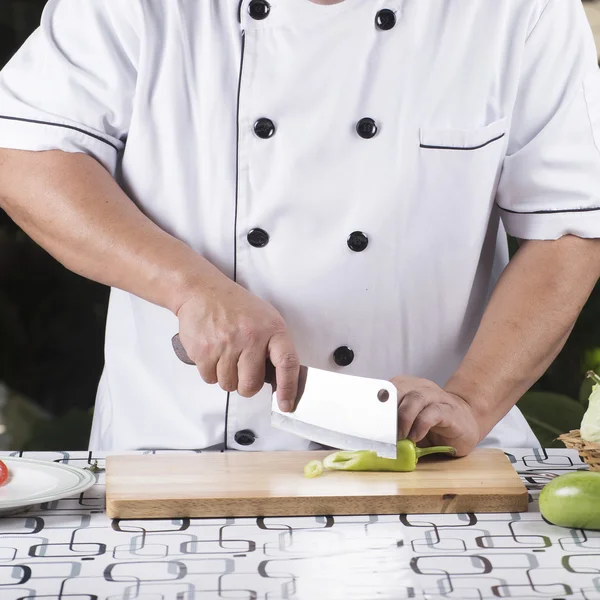Chef cutting pepper for slice — Stock Photo, Image