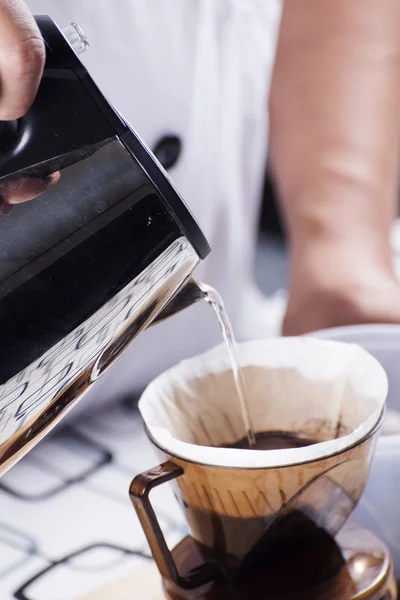 Pouring hot water to Fresh coffee on paper filter — Stock Photo, Image