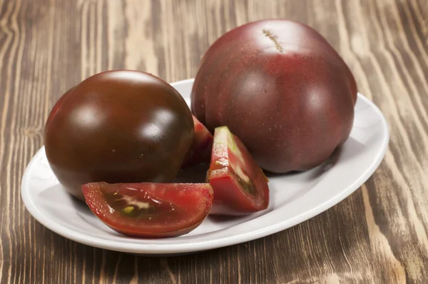 Dark tomatoes — Stock Photo, Image