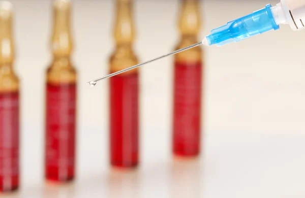 Syringe and ampules — Stock Photo, Image