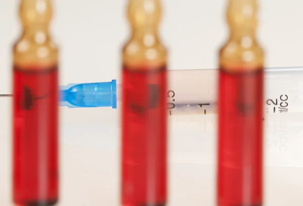 Syringe and ampules — Stock Photo, Image